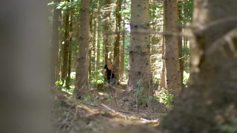 A-woman-with-long-hair-exercising-on-a-park-trail-by-running-short-sprints