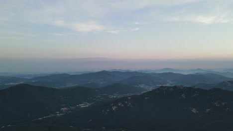 Beautiful-aerial-shot-over-a-mountain-valley-at-golden-hour-in-South-Korea