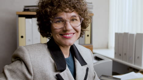 Close-up-view-of-businesswoman-in-vintage-office.