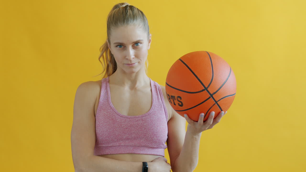 Woman playing with a basketball