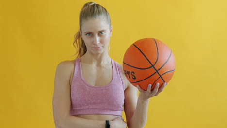 woman playing with a basketball