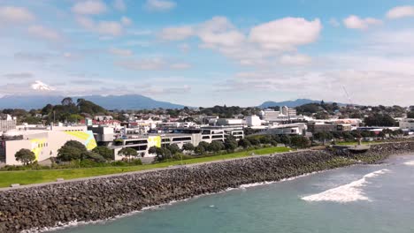 beautiful aerial drone shot of new plymouth city centre on new zealand shore