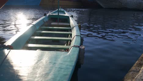 small boat leaning on the pier