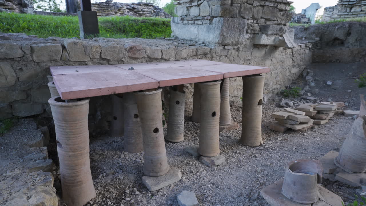 Closeup footage of a Roman hypocaust heating system showing brick pillars used for underfloor heating in ancient bathhouses