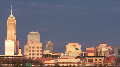 the skyline of the city of indianapolis at dusk