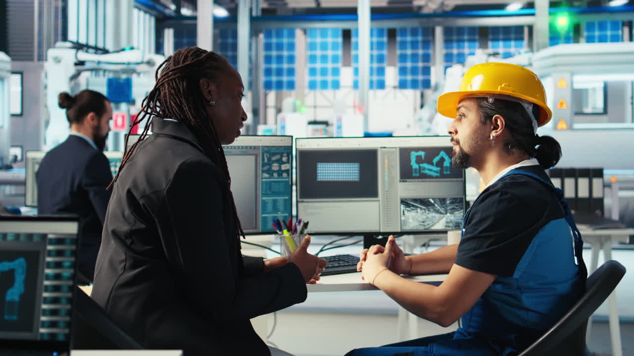 Photovoltaics factory manager chatting with engineer about energy production
