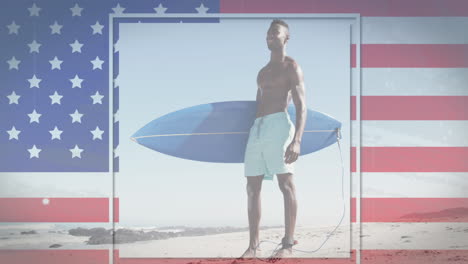 american flag with glitch effect against african american man with surfboard at the beach