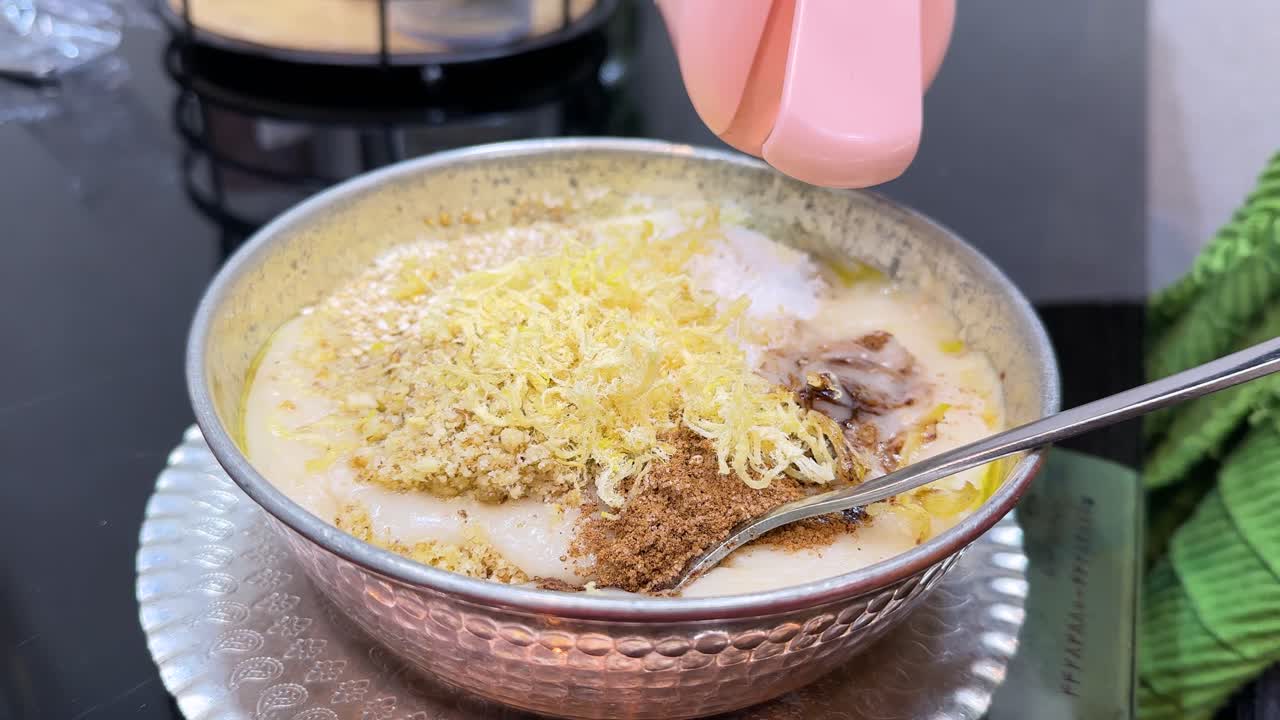 Traditional Persian haleem served in copper metal bowl and garnished with fried onions coriander healthy halal dish thick lentil soup Islamic cuisine Ramadan Iftar dinner Tehran Iran gastronomy