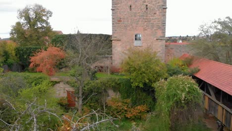 a-drone-flies-sideways-against-the-tower-and-approaches-the-covered-bridge