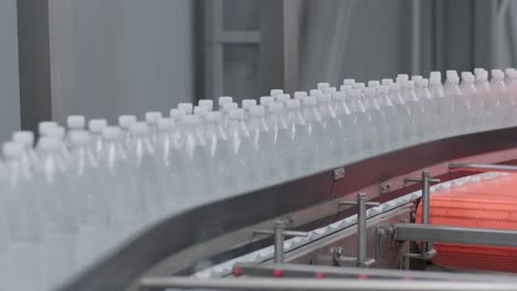 conveyor belt with bottles of drinking water at a modern beverage plant