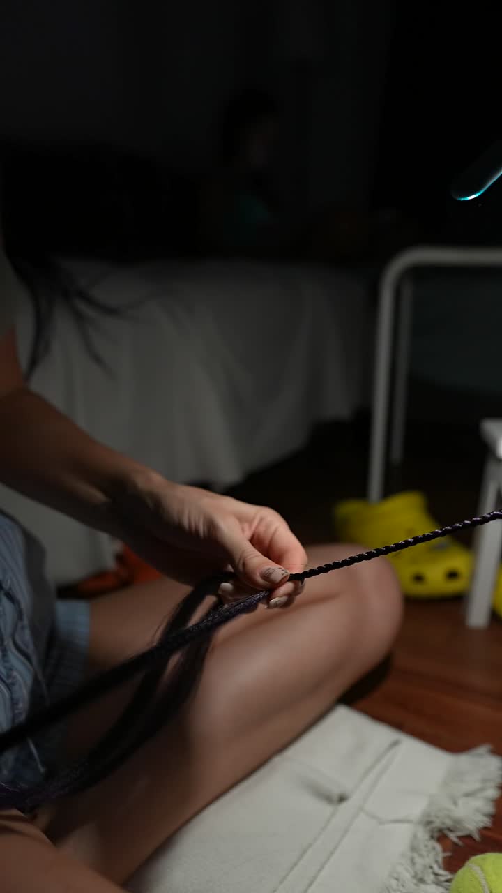 Braiding hair at night