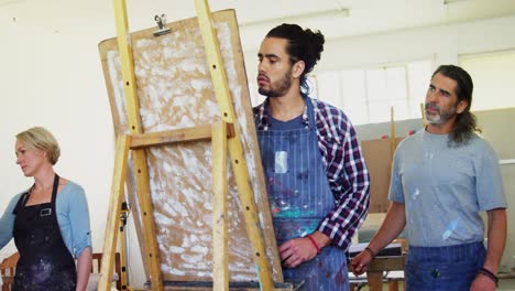 drawing teacher assisting man in drawing 4k