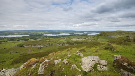 Time-lapse-of-rural-and-remote-landscape-of-grass,-trees-and-rocks-during-the-day-in-hills-of-Carrowkeel-in-county-Sligo,-Ireland