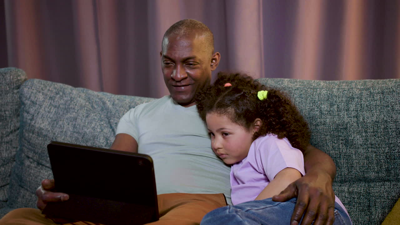 Kid watching film at home | Free Stock Video Footage