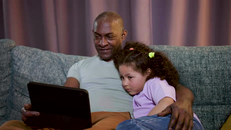 kid watching film at home