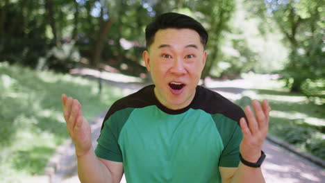 athletic shocked excited fitness runner man cover mouth in surprise looking at camera with big eyes