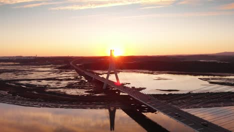 aerial view, locked down of bridge at the sunset