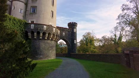 Push-in-wide-landscape-shot-during-sunset-of-Castle-Žleby-in-Czech-Republic