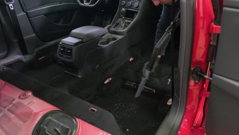 professional car cleaning. сar wash. interior detailing. dry clean and detail a car interior. deep seats cleaning. wiping foam in car wash. cleaning the car panel from dust. a vacuum cleaner