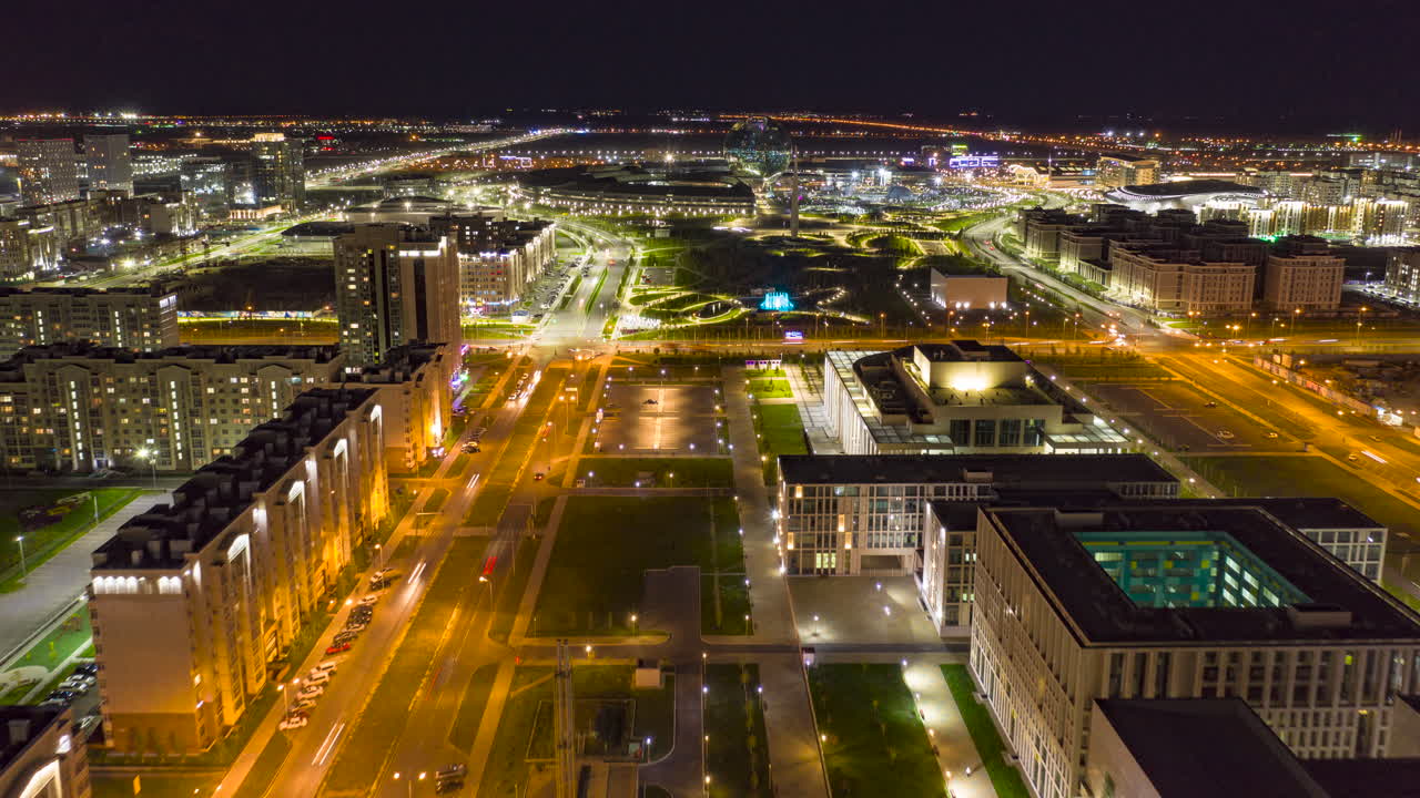 An aerial view along Turikstan Street in Nur Sultan Hyperlapse at night in Kazakhstan. Towards the Expo Centre.