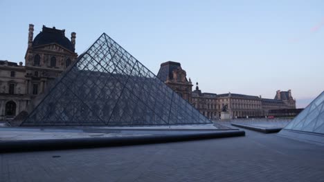 louvre pyramid and museum parallax with a truck shot on gimbal during early morning with nobody in paris