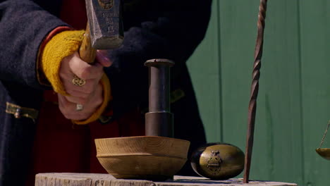 using a vintage punch from the viking era to make a coin