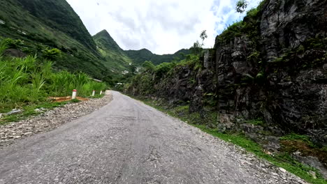 ha giang loop, northern vietnam, asia - riding a scooter along the scenic route near dong van - pov
