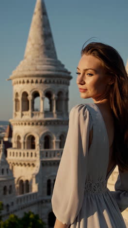 elegant woman posing at fisherman's bastion in budapest