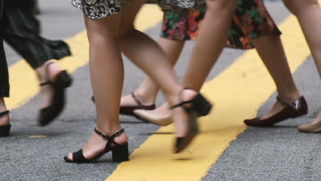 close up of people walking on crowded street in slow motion