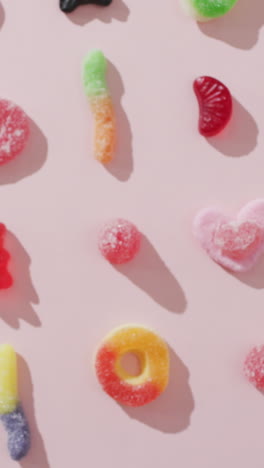 video of colourful jelly candy on pink background