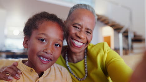 face, smile and selfie of kid with grandma