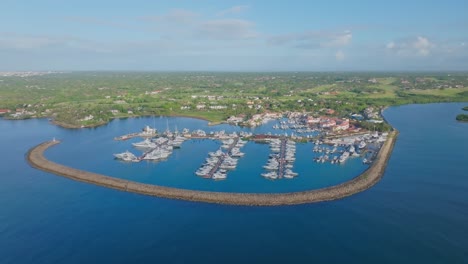 panoramic view over casa de campo marina in the dominican republic - aerial drone shot