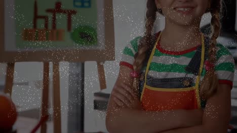 animación de confeti cayendo sobre una chica caucásica en la clase de arte