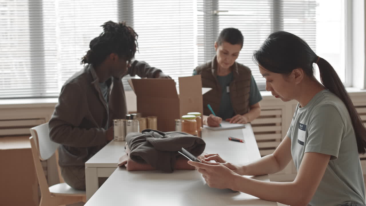 Volunteers packing donations at a food bank