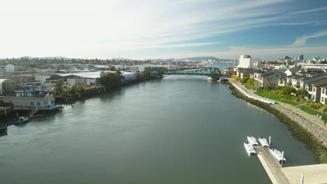 golden light casts shadows over the tidal canal as a drone captures the iconic park street bridge.