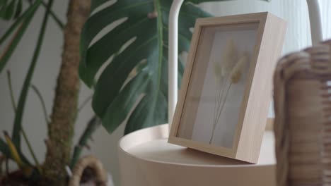 dried flowers in wooden frame decor