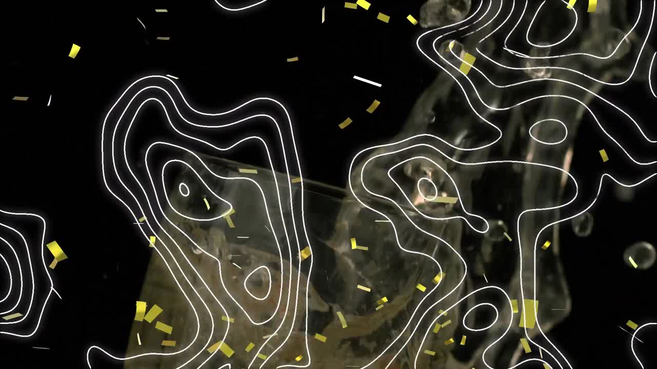 Topography and confetti falling against strawberry falling into a glass of champagne