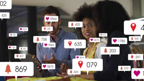 animation of social media data and icons over diverse business people in office