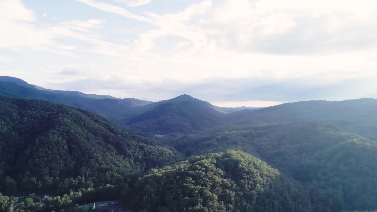 Drone panning across mountain range.