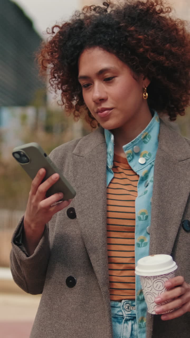 Young Woman Using Smartphone and Drinking Coffee