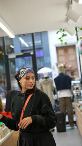 teenage girl shopping for accessories in a boutique