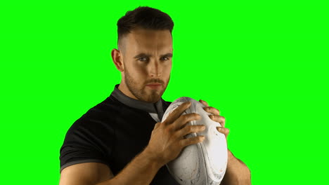 serious rugby player with ball