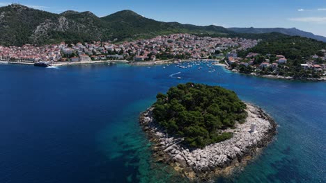 pan drone shot of hvar island surrounded with turquoise water body during daytime in croatia