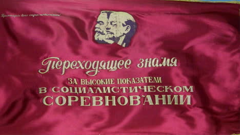 a soviet parade banner bearing the likeness of marx and lenin