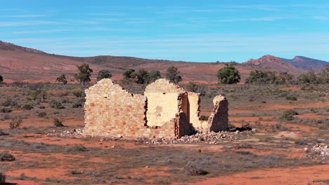 Aerial orbit shot circling historic stone ruin in Flinders Ranges outback, South Australia