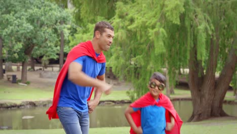 father and son pretending to be superheroes