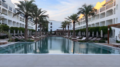 luxury resort pool with palm trees