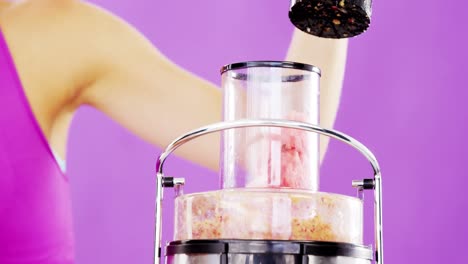 woman preparing smoothie