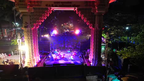people are sitting and watching the bharatanatyam at dadar chow patty beach bird eye wide to closeup view mumbai