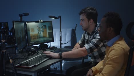 two people collaborating on video editing